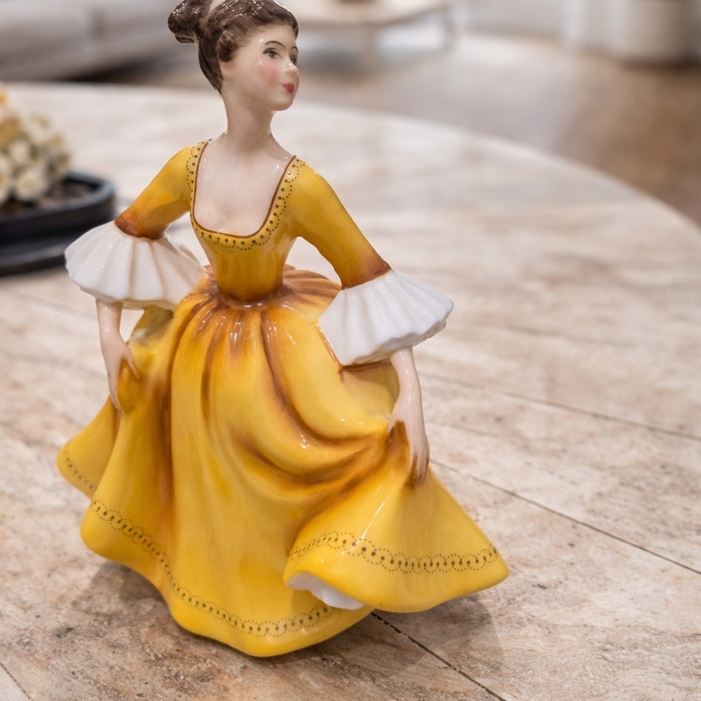 Elegant Yellow Porcelain Figurine